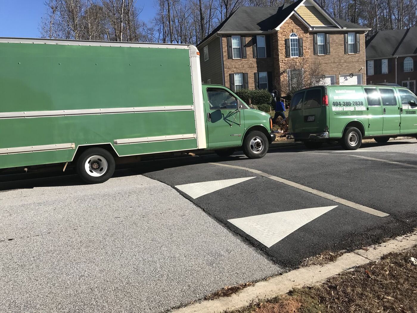 Morris Plumbing & Water Restoration box truck at an Atlanta job site