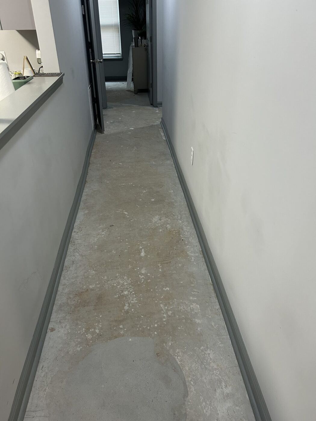 Hallway stripped to slab after standing water was extracted