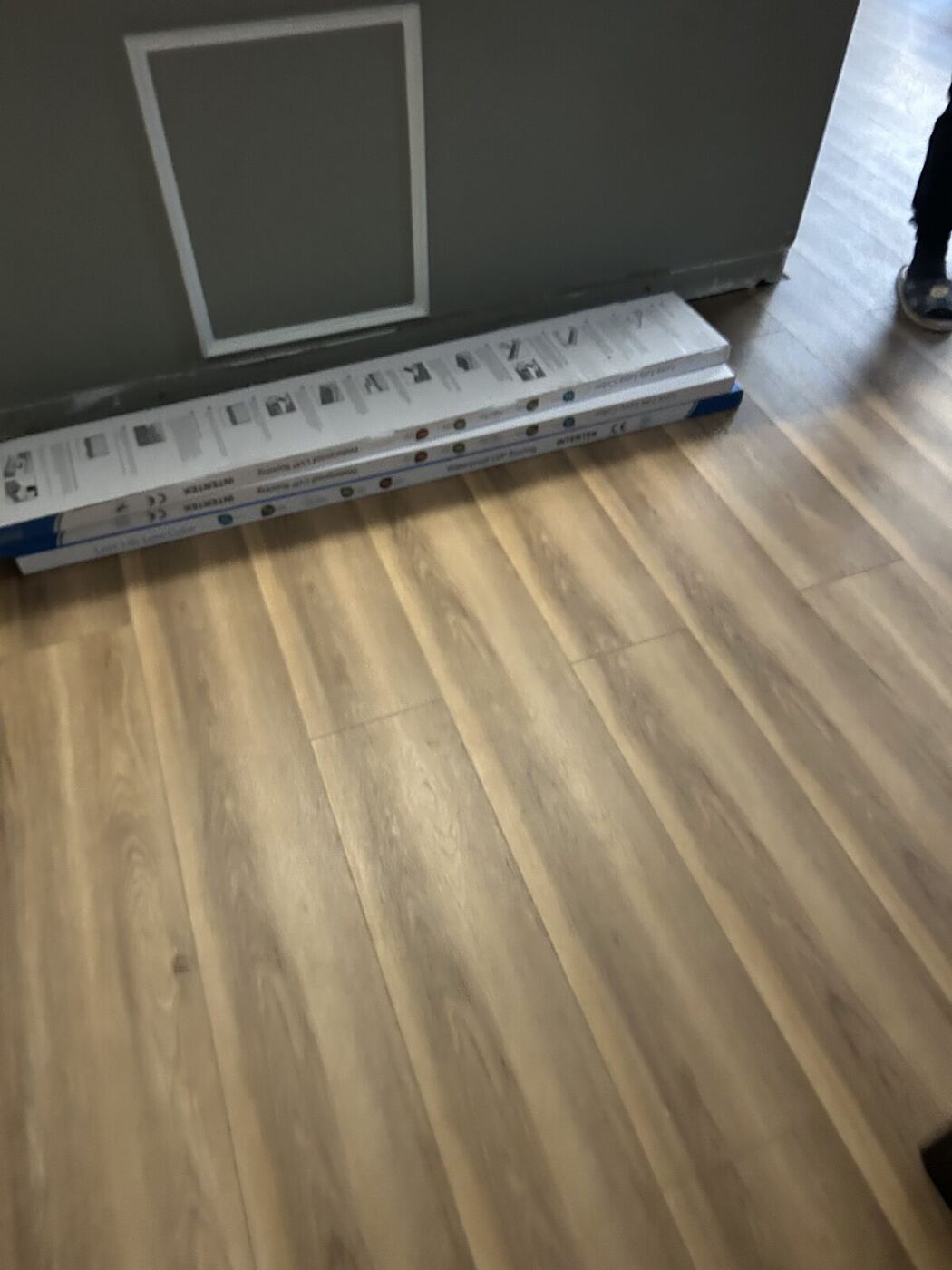 Restored laundry room with new flooring after a washer hose failure