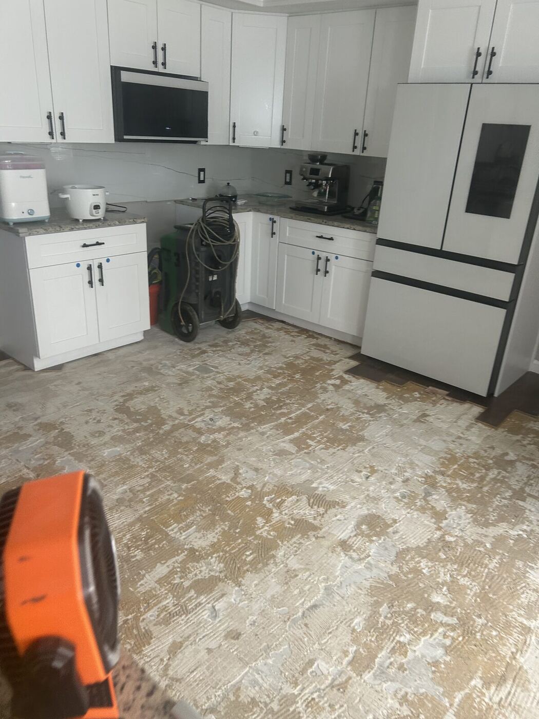 Living room floor torn out after a burst pipe flooded the home