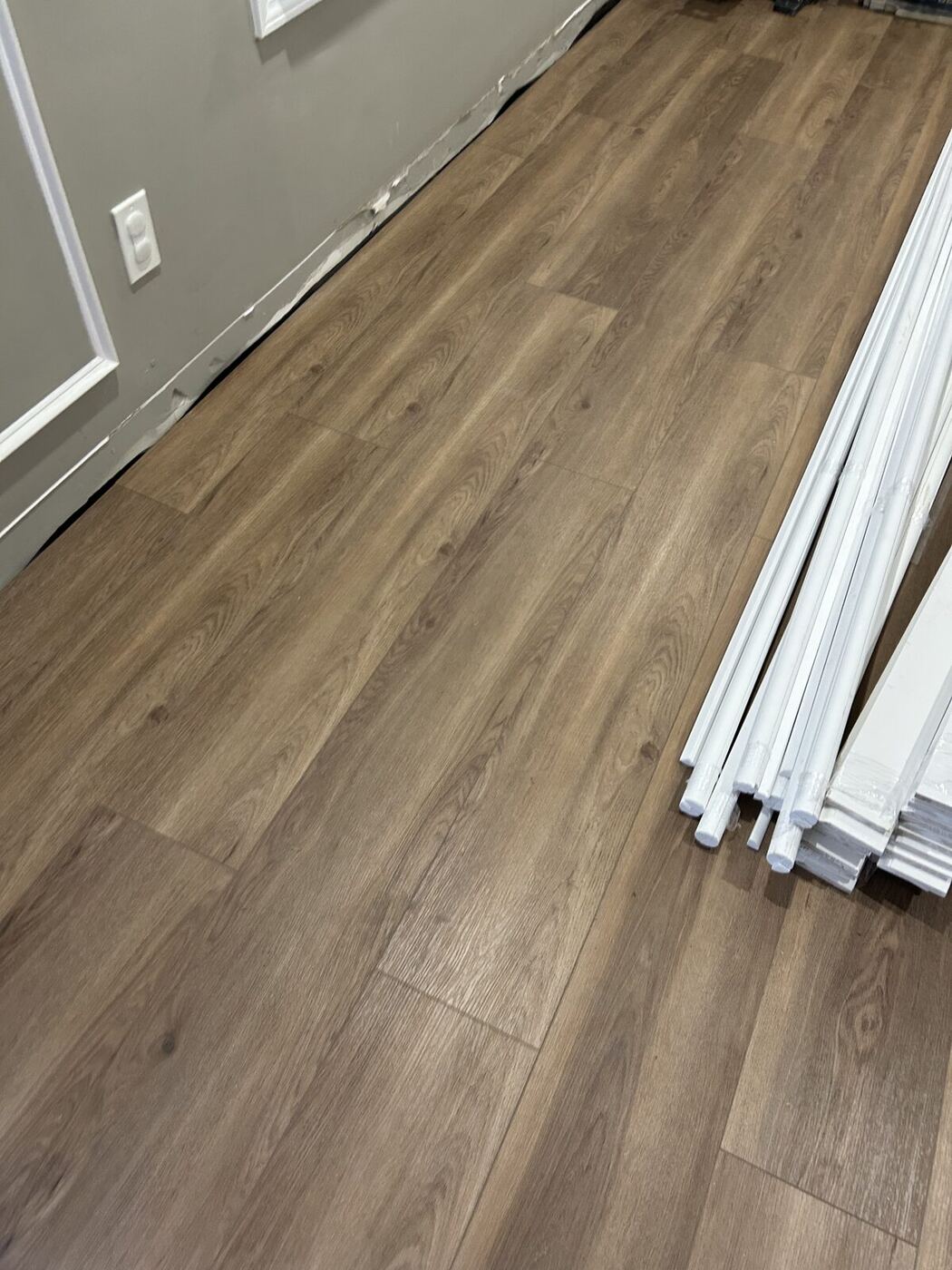 New luxury vinyl plank floor installed after a water damage rebuild