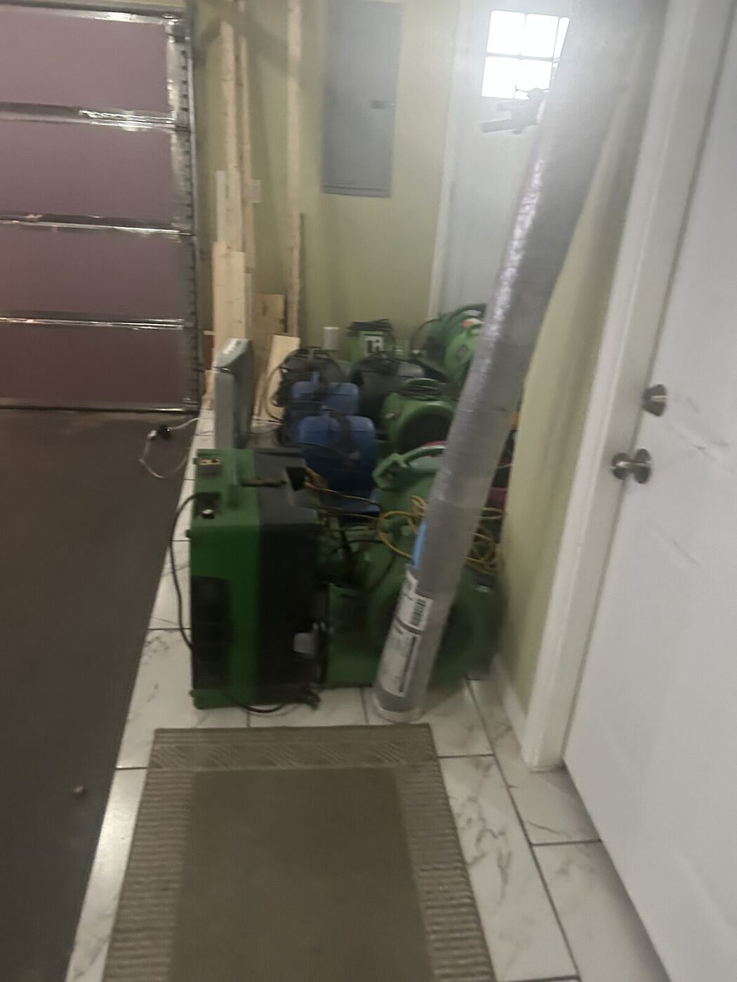 Drying equipment set up in a hallway after water damage