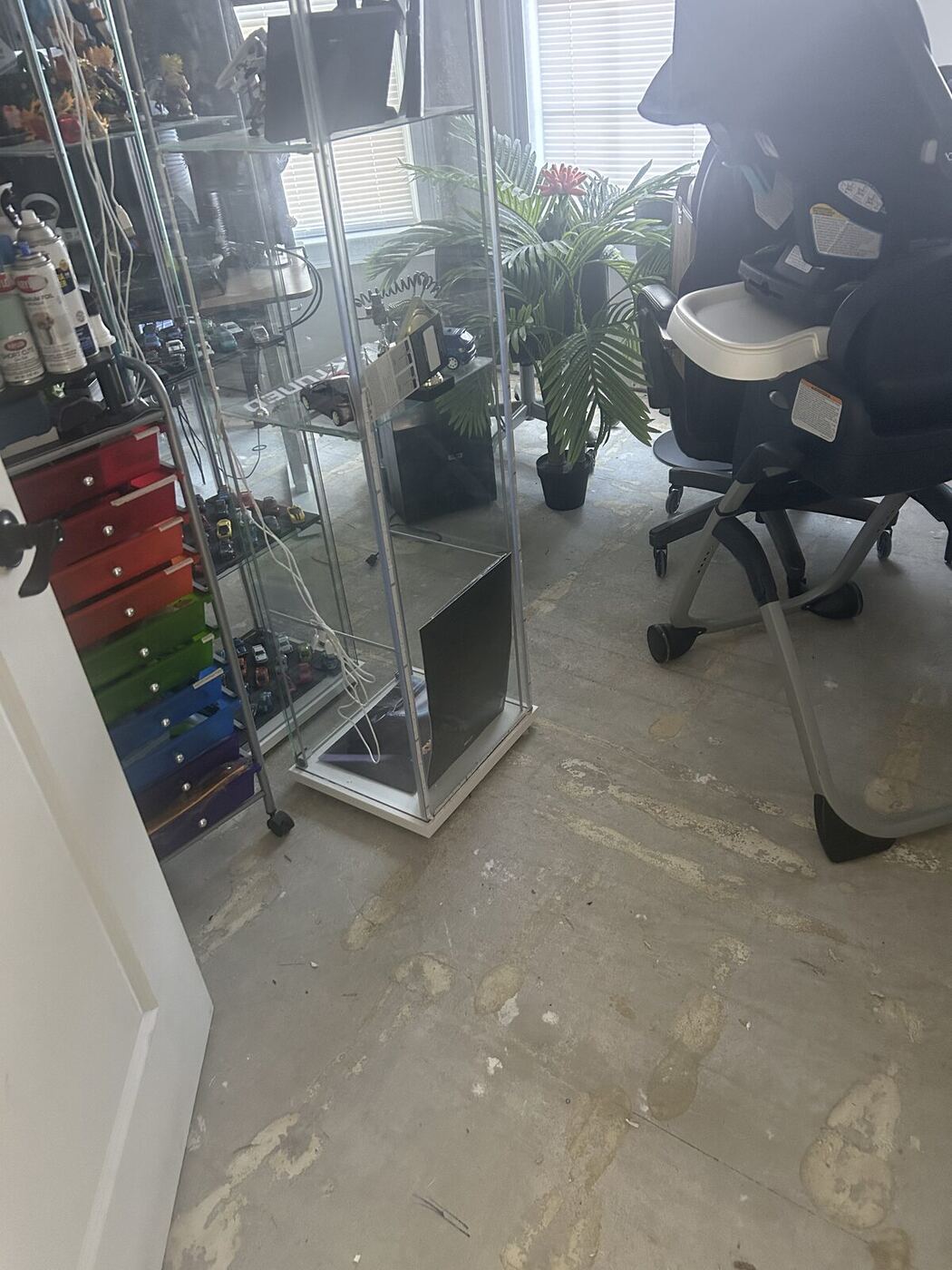 Water damaged flooring removed down to slab in a home office